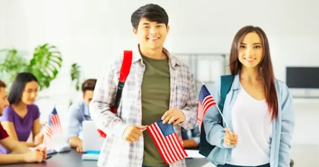 Students holding U.S. flags representing the USA student visa process
