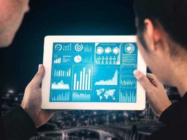Big Data Technology for Business Finance Analytic Concept. Modern graphic interface shows massive information of business sale report, profit chart and stock market trends analysis on screen monitor.