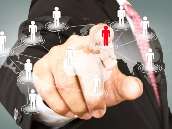 Social Network concept : hand point to social network and world map